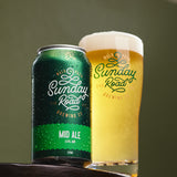 Green can and glass of Sunday Road Mid Ale on a wooden surface with a green background in kirrawee taproom